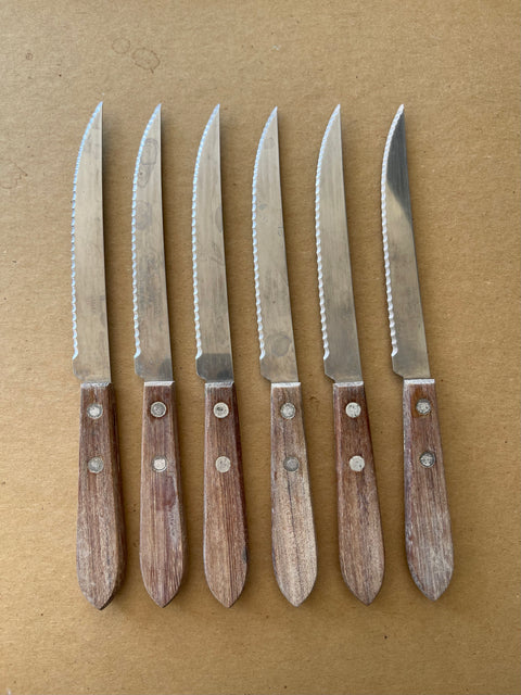 SIX STEAK KNIVES.