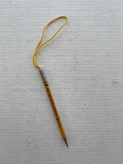 Pencil on a shop string