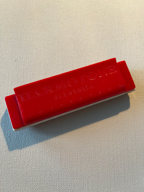 VINTAGE PLASTIC HARMOTONE HARMONICA.